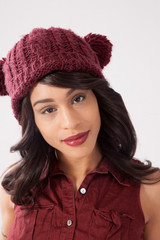 Happy woman in a red knit cap