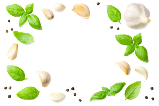 garlic with basil isolated on white background, top view