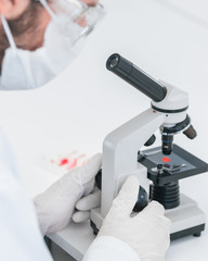 close up. scientist uses a microscope in a modern laboratory.