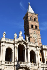 Fototapeta na wymiar Basilica di Santa Maria Maggiore. Facade and Tower with blue sky. Rome, Italy.