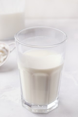 Fermented kefir in a glass on a white background. Dairy Products. Vertical Image