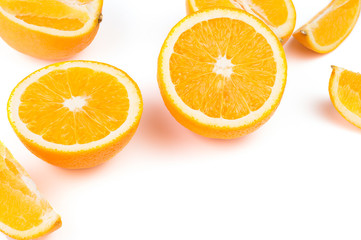 Oranges, sliced ​​in half on a white background. The top view has space for text design.