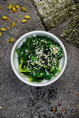 Chuk seaweed salad and sesame seeds. Chinese cuisine.