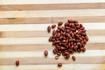 Pile of Peanuts on a Cutting Board