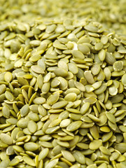 Macro background texture of green pumpkin seeds