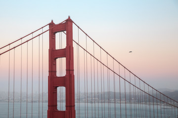 close view of the iconic Golden Gate Bridge at sunset