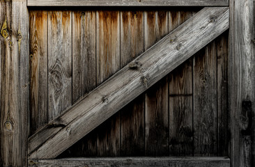 Old wooden gate with rustic wooden planks