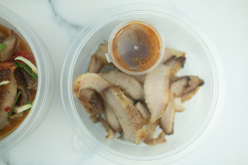Charcoal-boiled pork neck served with the sauce is spicy sour taste