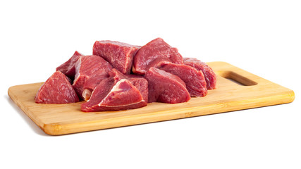 Chopped raw meat on wooden board isolated on white background