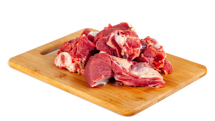 Chopped raw meat on wooden board isolated on white background