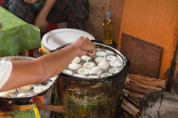 Typical coconut pancakes cooked in the alleys of central Phnom Penh
