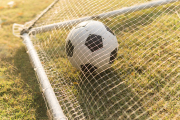 soccer ball in goal net