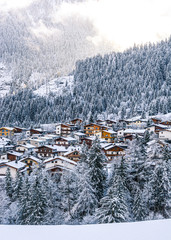Mountain landscape in winter with village, Austria 