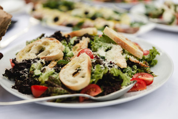 wedding table full of varied dishes with salad,party reception,Buffet
