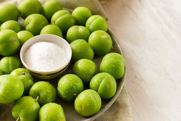 Unripe sour green plums with salt. Traditional turkish snack - Tuzlu erik