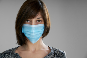 Portrait of a young woman with a nurse mask for prevention during coronavirus lock down