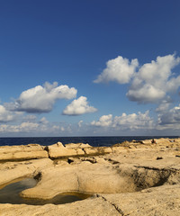 Fototapeta na wymiar Sea view with blue sky from rocks in Valetta, Malta