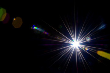 Flare background. Sunlight ray flash effect on black. Star spot or sun shine glow light on lens. Gleams rounded and hexagonal shapes, rainbow halo.