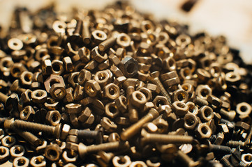 Close-up, macro. Old Soviet brass countersunk head screws with a flat head screwdriver. Texture,...