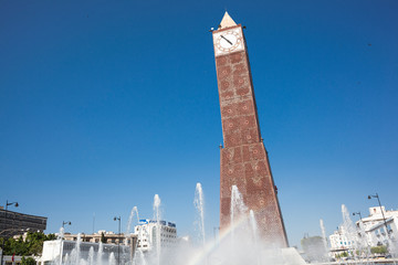 Tunis, Tunisia - The clock tower in the capital city with the rainbow.
