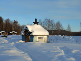 Small cabin covered in snow in Finland