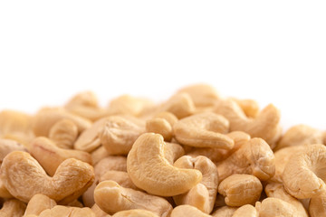 A Pile of Raw Natural Cashew Nuts Isolated on a White Background