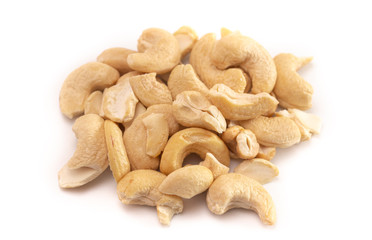 A Pile of Raw Natural Cashew Nut Pieces Isolated on a White Background