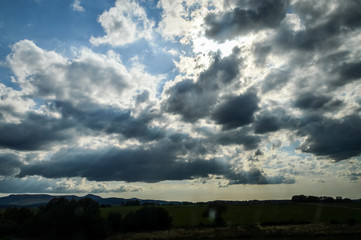 Beautiful cloudy sky at sunset in the french countryside - background