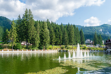Fototapeta na wymiar Artesian fountain from the Miorita lake, Poiana Brasov, Romania