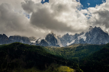 French Alps mountains in a cloudy summer day, seen from Chamonix, Haute Savoy, France.