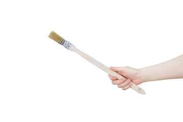 Brush for painting radiators in the hand of caucasian woman. White isolate.