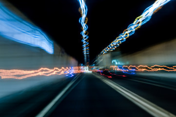 Drunk driving. View from eyes of a drunken driver. Long exposure picture of lights on a tunnel...