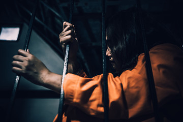 Portrait of women desperate to catch the iron prison,prisoner concept,thailand people,Hope to be...