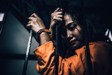 Portrait of women desperate to catch the iron prison,prisoner concept,thailand people,Hope to be...
