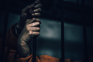 Portrait of women desperate to catch the iron prison,prisoner concept,thailand people,Hope to be...
