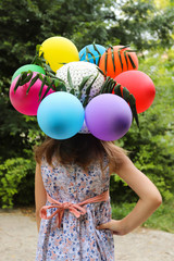 girl with colorful balloons