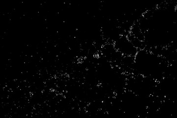 Splashes and drops of water are on a black background.