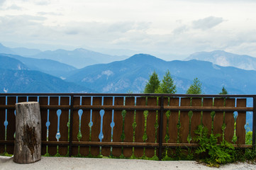 Beautiful wooden fence on a background of alpine mountains.
