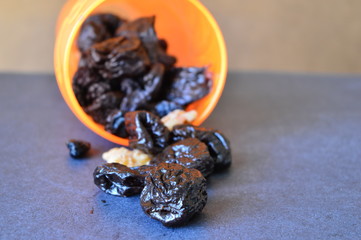 dried fruits and nuts in a orange  bowl