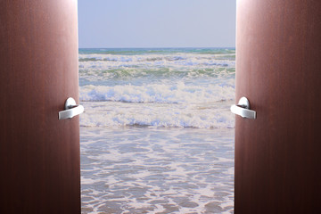 Sale of tourist tickets, airline tickets, service. Doors swing open overlooking the sea waves on the beach