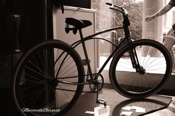 Fototapeta na wymiar Bicycle Parked By Glass Wall