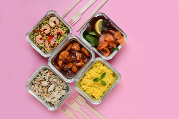 Different aluminium lunch box with healthy meals for lunch. Healthy food restaurant dish delivery. Take away fitness food. top view