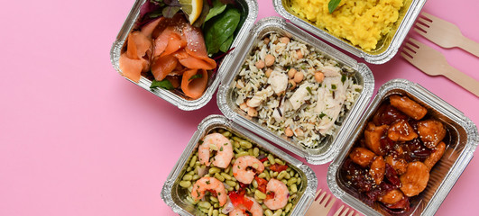 Different aluminium lunch box with healthy meals for lunch. Healthy food restaurant dish delivery. Take away fitness food. top view