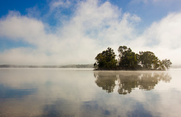 island with reflections and fog