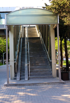 Stairs of pedestrian overpass. Image of footbridge. Indoor elevated pedestrian crossing	