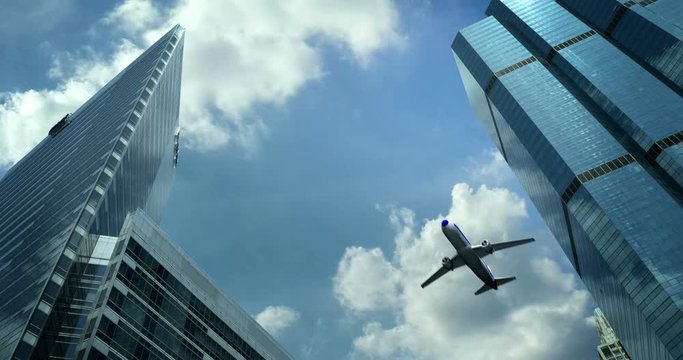 an airplane flying over the skyscrapers of the city of Abu Dhabi