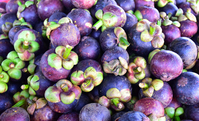 Pile of mangosteen with blurred background.