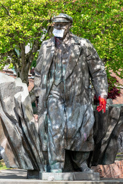 Coronavirus face mask covers Lenin sculpture in Fremont, Seattle