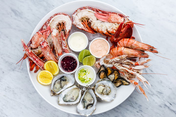 Mixed seafood platter of oysters, lobster and king prawns 