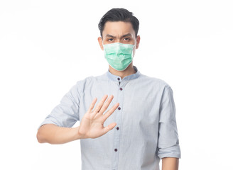 Young Asian businessman wearing hygienic mask gesturing stop to prevent infection, 2019-nCoV or coronavirus. Airborne respiratory illness such as pm 2.5 fighting and flu isolated on white background.